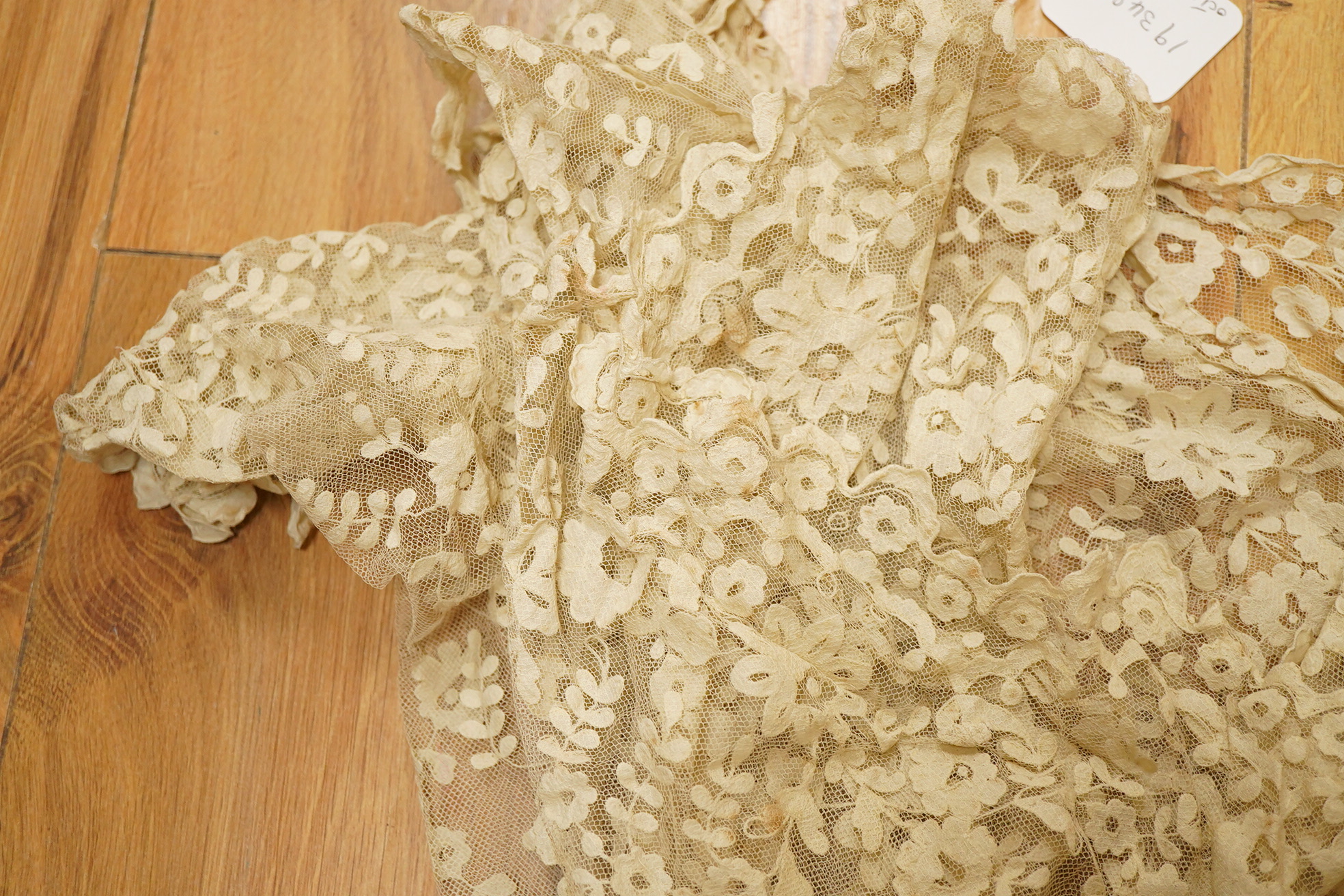 An Irish late 19th, Carrick Cross, Irish lace ladies shaped cape with collar, 200cm wide x 88cm long. Condition - a few dark rust stains and slight catches to net, but mainly in good condition.